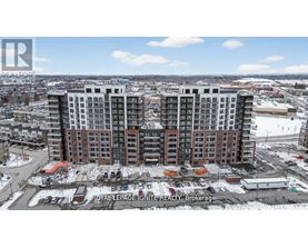 A large, multi-story building with a parking lot in front of it.