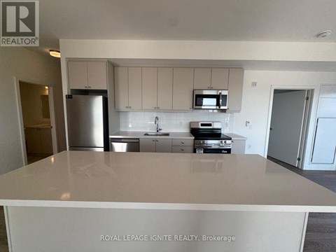 A kitchen with white cabinets and appliances is for sale.