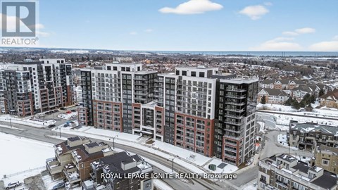 A real estate company logo is displayed on a snowy landscape with apartment buildings.