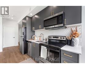 A modern kitchen with a black microwave above the stove.