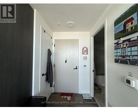 A hallway with a door on the left and a door on the right.