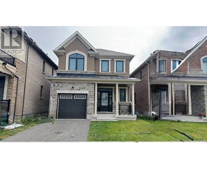 A house with a garage and a driveway in front.