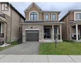 A house with a garage is for sale.