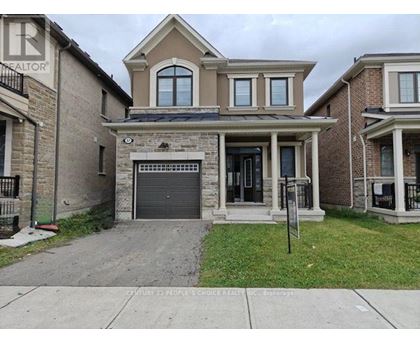 A house with a garage is for sale.