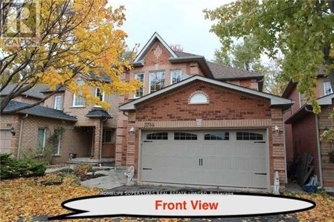 A house with a front view and a garage.