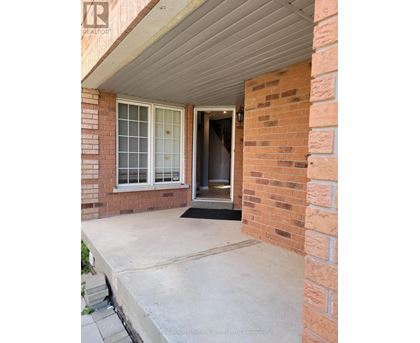 A house entrance with a door and a window.