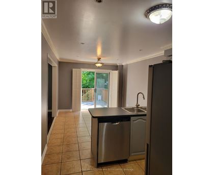 A kitchen with a sink and a dishwasher.