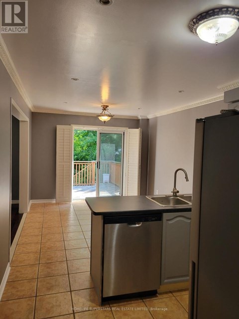 A kitchen with a sink and a dishwasher.