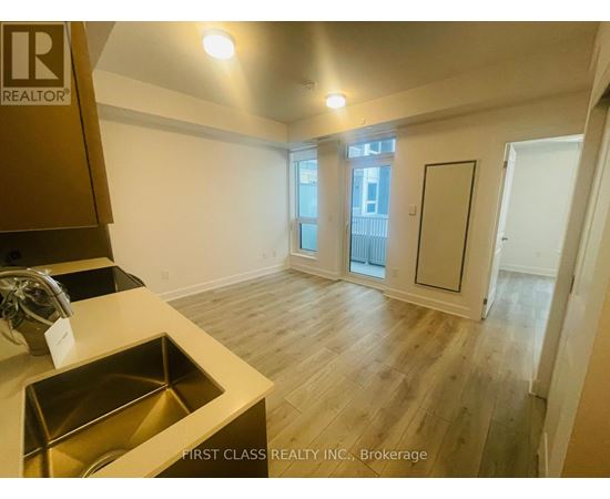 A kitchen with a sink and a window.