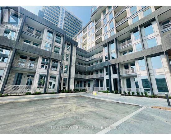 A large, modern building with the words "First Class Realty Inc." on the side.