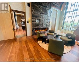 A living room with a fireplace and a large mirror on the wall.