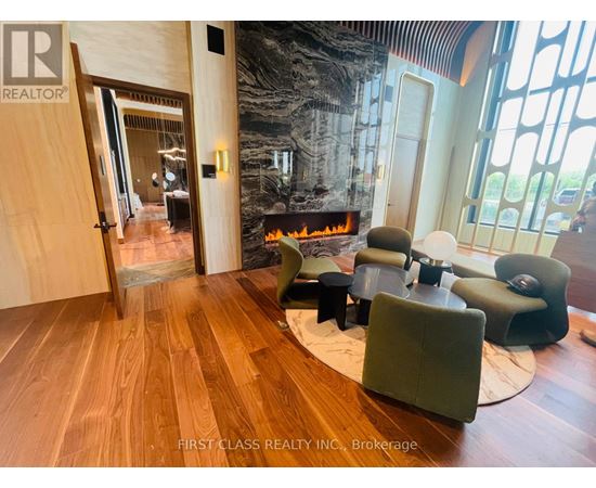 A living room with a fireplace and a large mirror on the wall.
