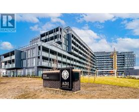 A large building with a sign that reads "ADI" in front of it.