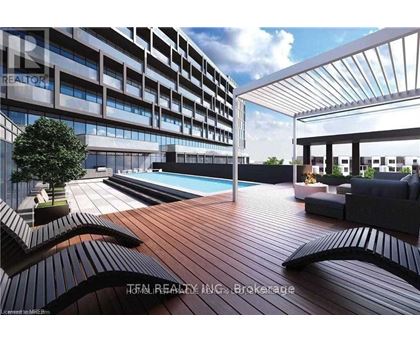 A modern outdoor pool area with a wooden deck and lounge chairs.