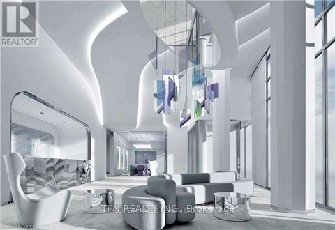 A modern living room with white furniture and a large window.