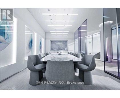 A modern conference room with a large table and chairs.