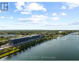 A real estate brokerage office overlooks a river.