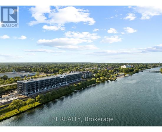 A real estate brokerage office overlooks a river.