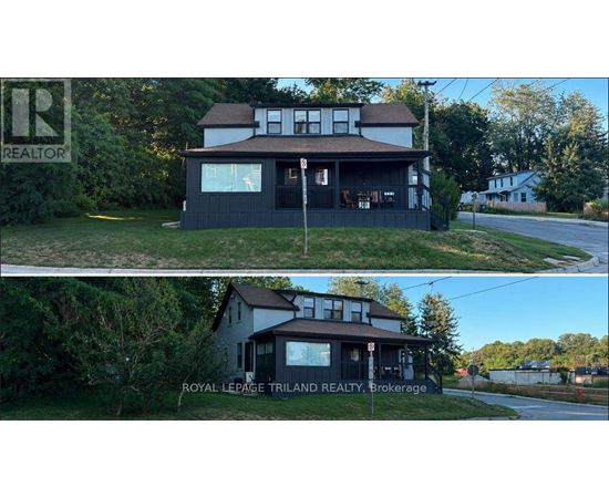 A house with a sign that says REALTOR in the upper left corner.