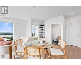 A modern dining room with a glass table and chairs.
