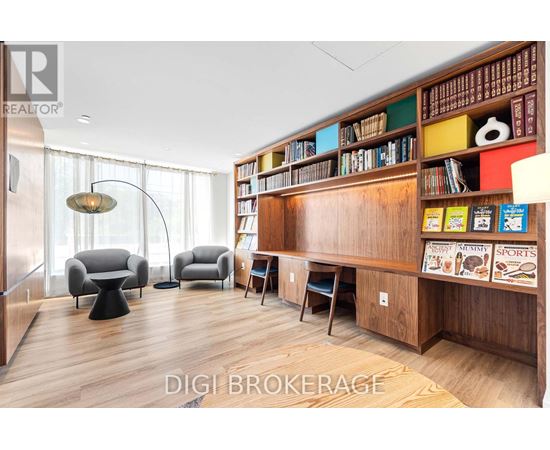 A living room with a bookshelf filled with books and magazines.