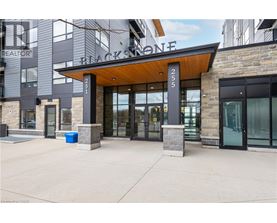 The entrance to a building with a sign that reads "Blackstone.".