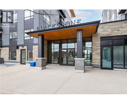 The entrance to a building with a sign that reads "Blackstone.".