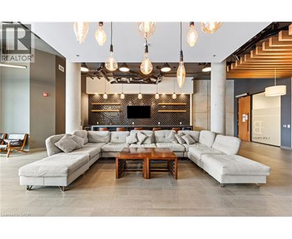 A modern living room with a large sectional sofa and a coffee table.