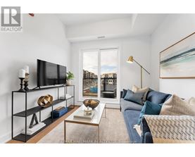 A living room with a television, a sofa, and a coffee table.