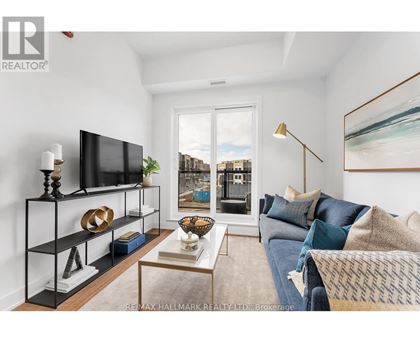 A living room with a television, a sofa, and a coffee table.