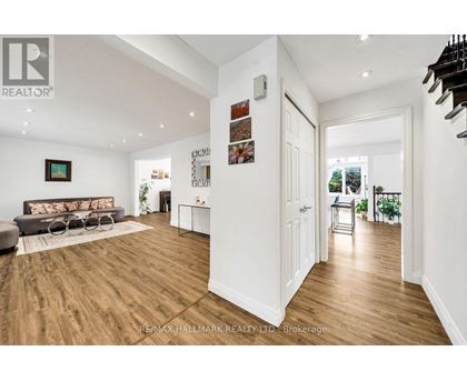 A spacious living room with a grey sofa and a coffee table.