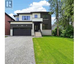 A modern house with a garage and a driveway.