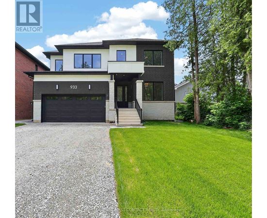 A modern house with a garage and a driveway.