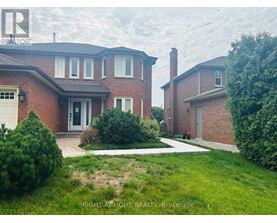 A house with a red brick exterior and a white garage door is for sale.