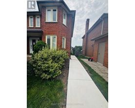 A house with a sign that says REALTOR in the upper left corner.