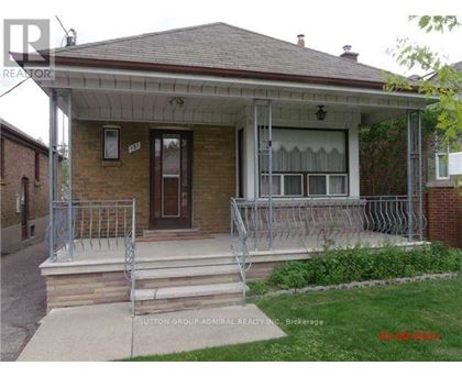 A house with a porch and a front yard.