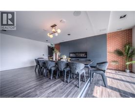 A modern dining room with a long table and chairs.