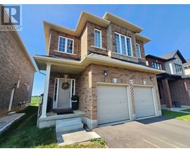 A two-story house with a garage is for sale.