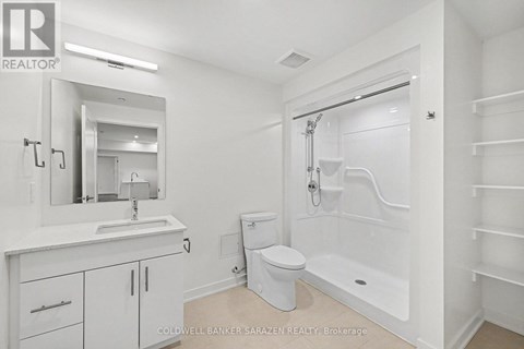 A white bathroom with a toilet, sink, and bathtub.