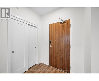 A room with a white door and a brown door.