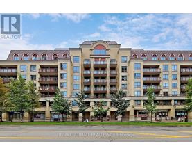A large apartment building with balconies and multiple stories.