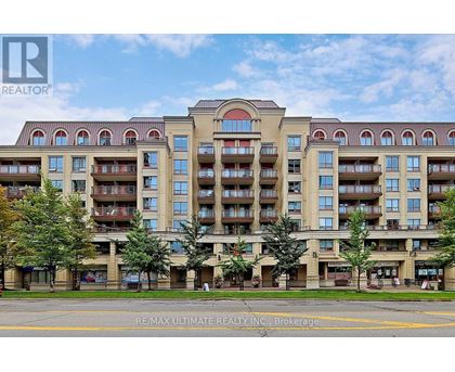 A large apartment building with balconies and multiple stories.