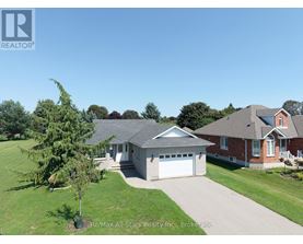 A house with a garage is for sale.
