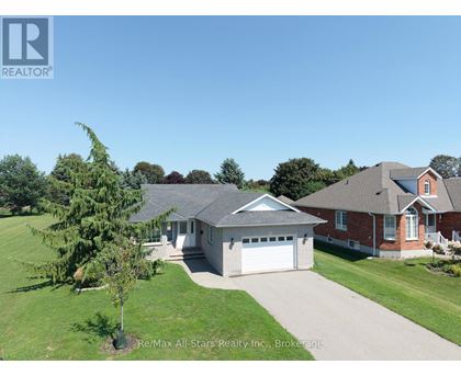 A house with a garage is for sale.