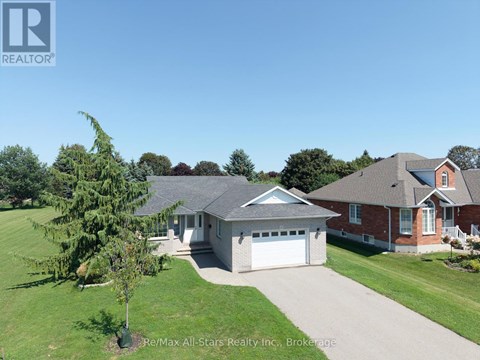 A house with a garage is for sale.