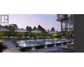 A large outdoor swimming pool surrounded by lounge chairs and umbrellas.
