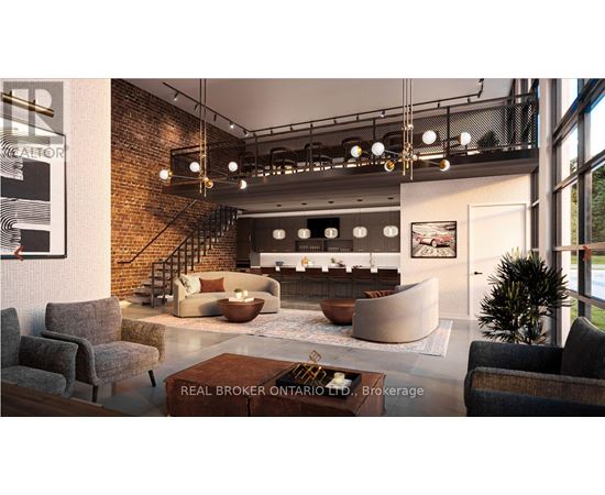 A living room with a brick wall and a staircase.