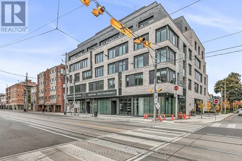 A street view of a building with the sign REALOSOPHY REALTY INC. Brokerage.