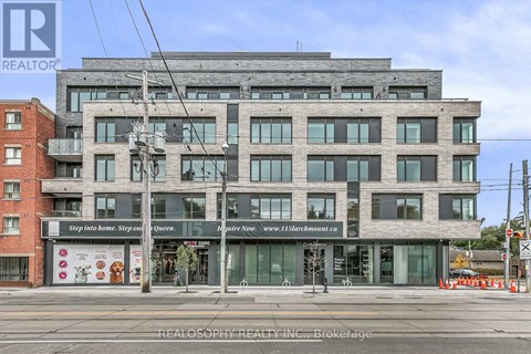 A multi-story building with a sign that reads "Step inside home. Step out Queen."