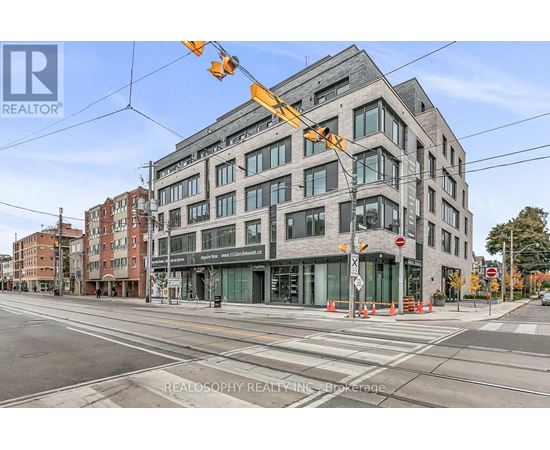A street view of a building with the sign REALOSOPHY REALTY INC. Brokerage.